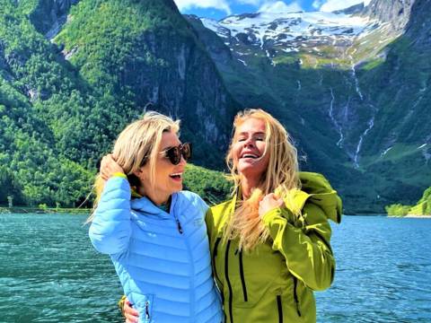 "CEO of Visit Sognefjord, Heidi Hauge, experiencing the 'Human Edge' and the serene 'Hyper-nature' of Finnabotn with Balestrand Fjord Angling. A high-end, sustainable fjord tour in the Sognefjord, showcasing authentic Norwegian travel and the emotional power of the pristine landscape."